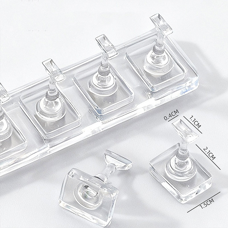 Acrylic nail display stand holding cat eye gel nails—non-magnetic fingers preserve magnetic stripe patterns.