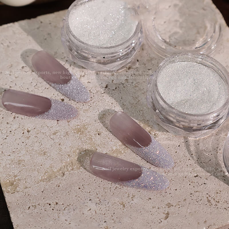Crushed glitter application demo—finger coated in diamond star sparkle powder.