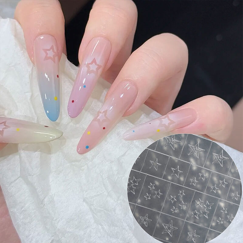 Nails with star designs on a white towel.