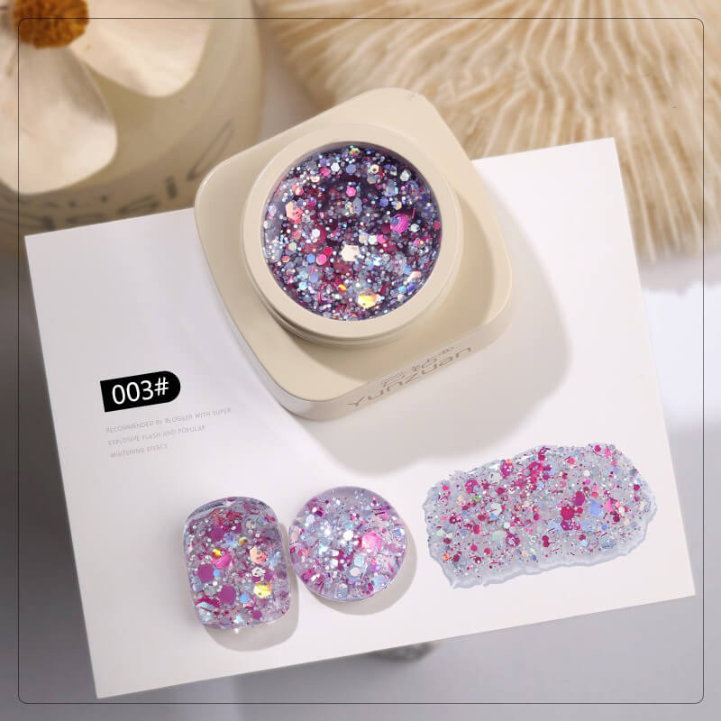 Ultra sparkle glitter gel polish bottle with shimmering holographic particles visible through glass.