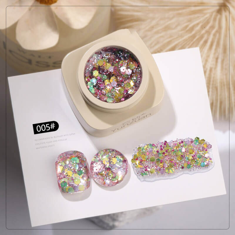 Holographic nail gel in sleek bottle showing prismatic sparkle suspended in clear base.