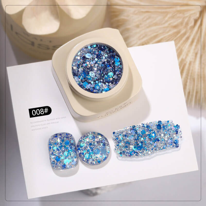 Blue glittery nail art set on a white background