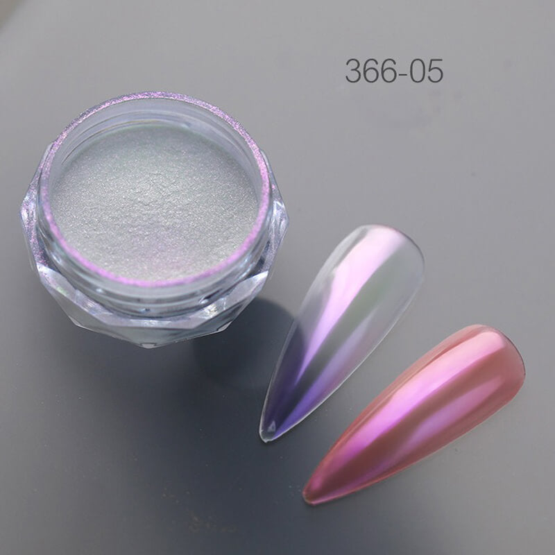 Nail art powder in a jar with a pink and purple nail tip on a gray background