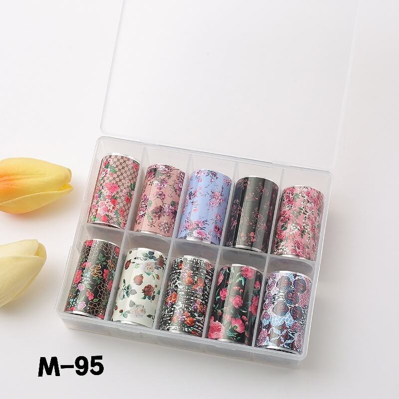 Set of floral nail art foils in a clear plastic case on a white background