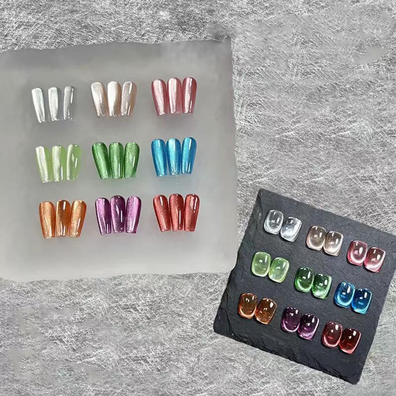 Set of colorful nail art sheets on a textured gray background