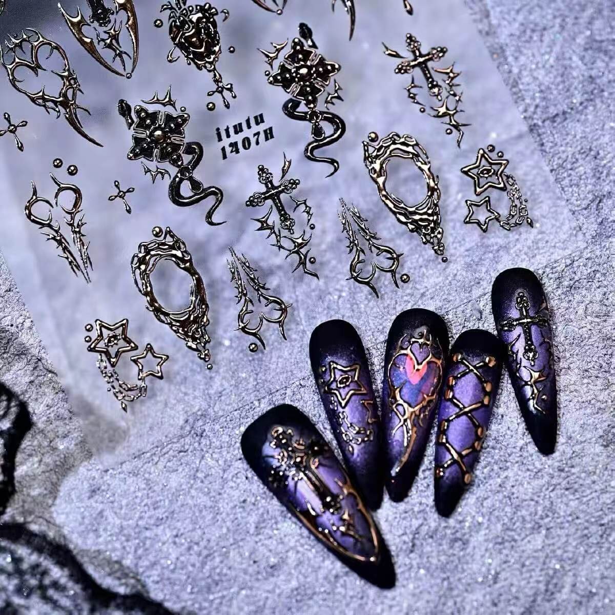 Gold and silver nail decals with dark aesthetic patterns