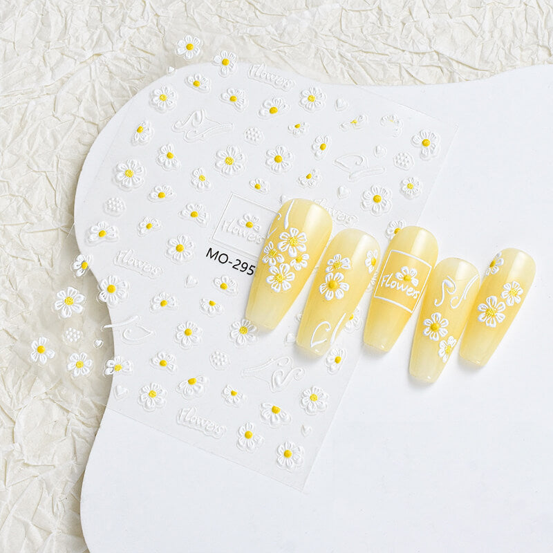 Hand model wearing 5D flower and bee stickers on soft green base for garden look