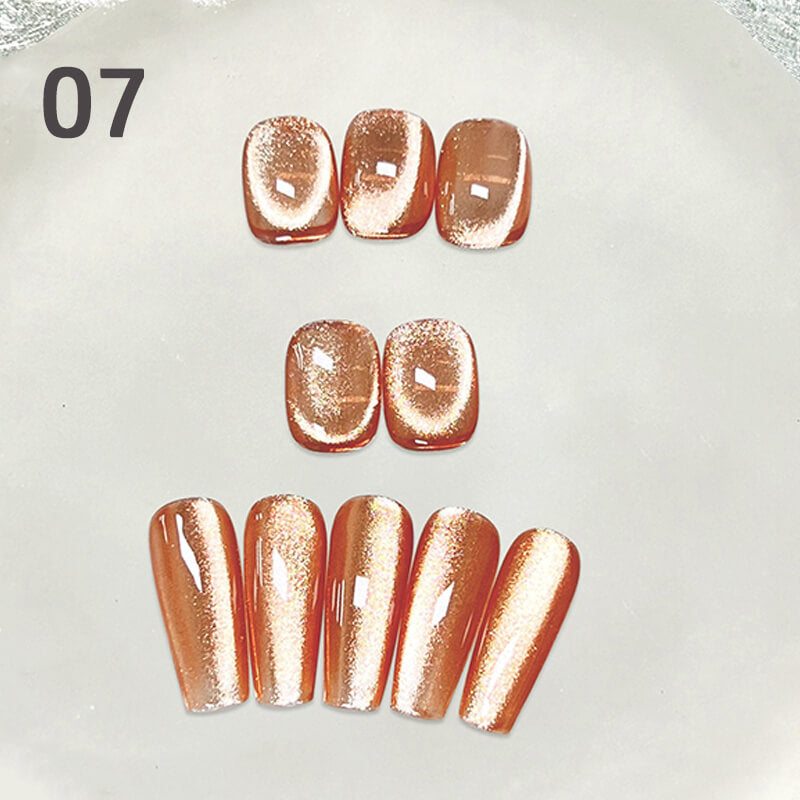 Set of rose gold nail extensions on a light gray background with '07' displayed.