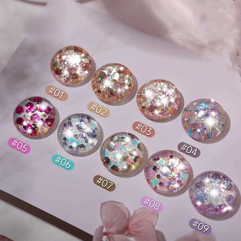 9-color glitter gel polish palette with assorted shimmer shades arranged in rows.
