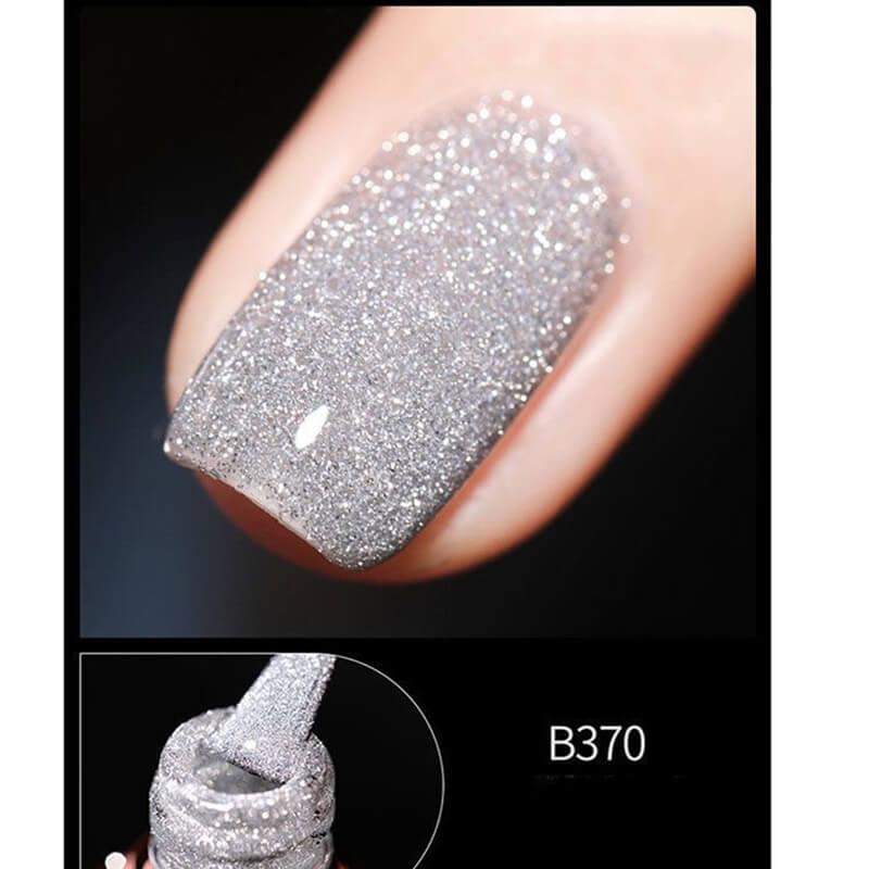 Close-up of a glittery silver nail polish on a black background