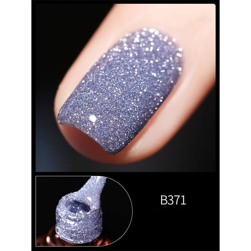 Close-up of a glittery purple nail polish on a person's nail with a smaller inset showing the polish in a bottle.