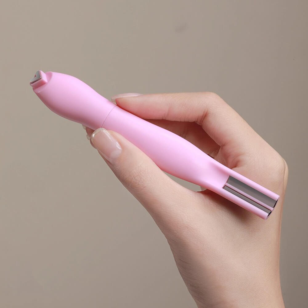 Hand holding professional 3-in-1 cat eye magnet positioned over wet magnetic gel