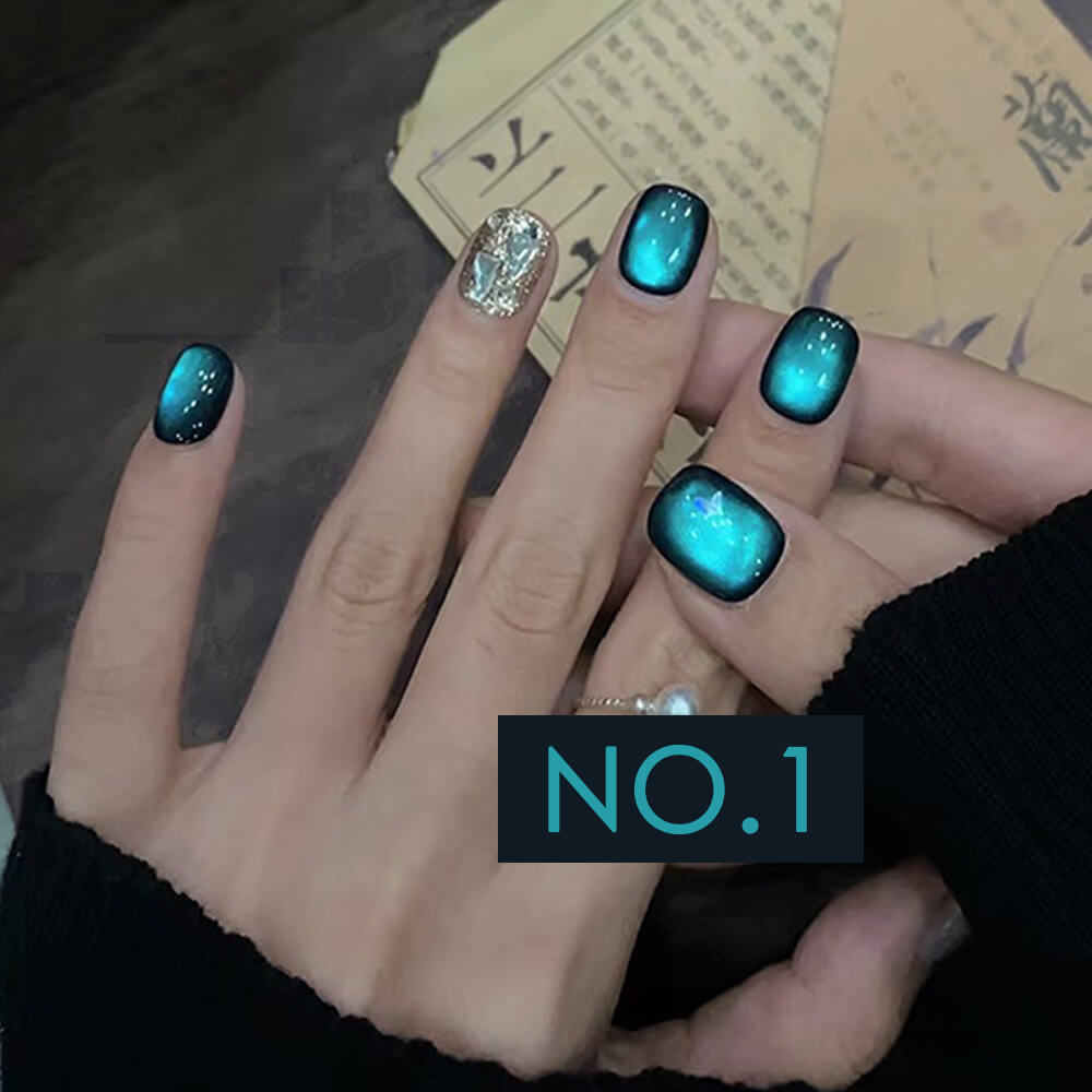 Hand model wearing galaxy cat eye gel with cosmic purple and blue magnetic shimmer