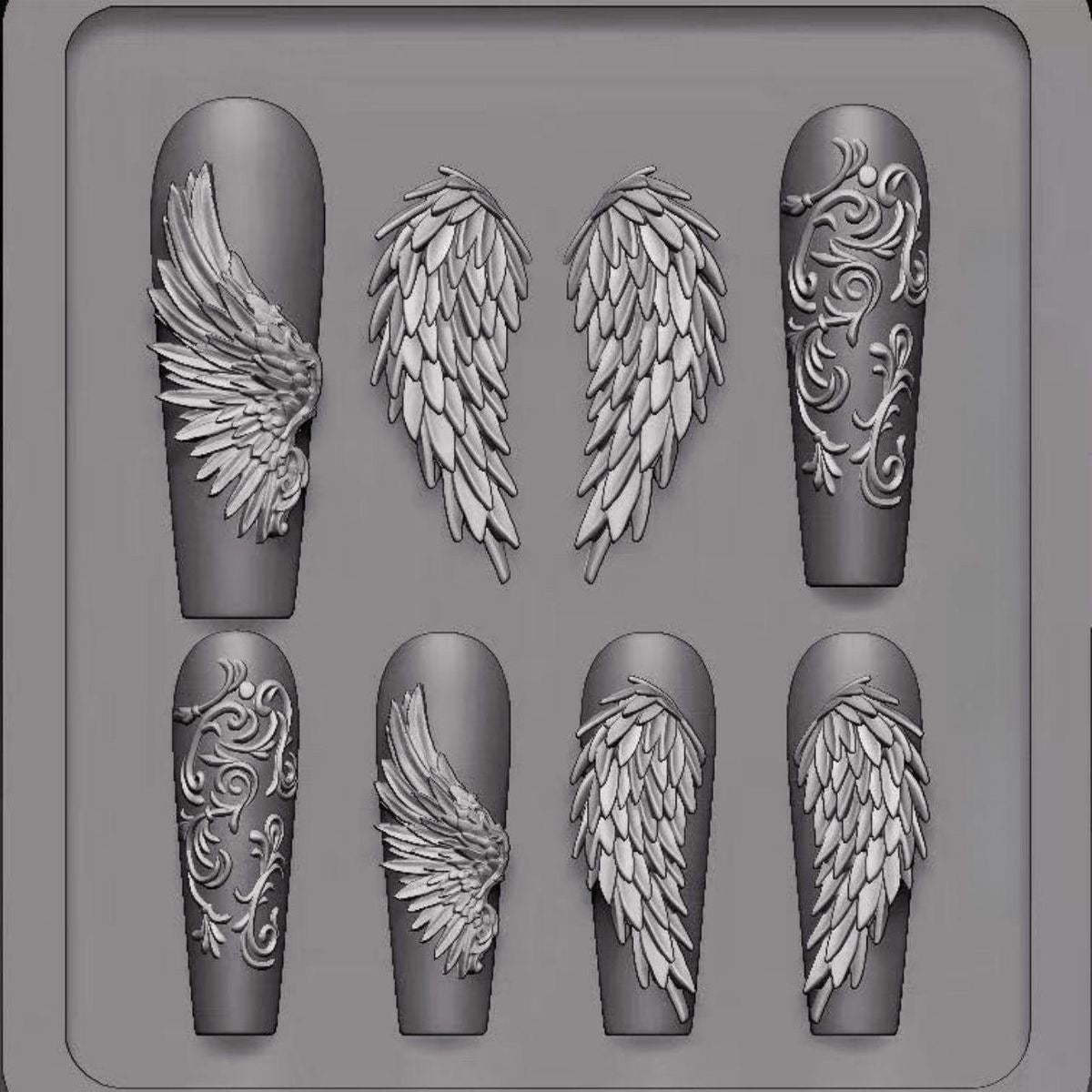 Nail art mold with angel wing designs on a gray background