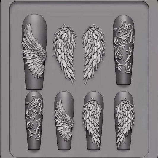 Nail art mold with angel wing designs on a gray background