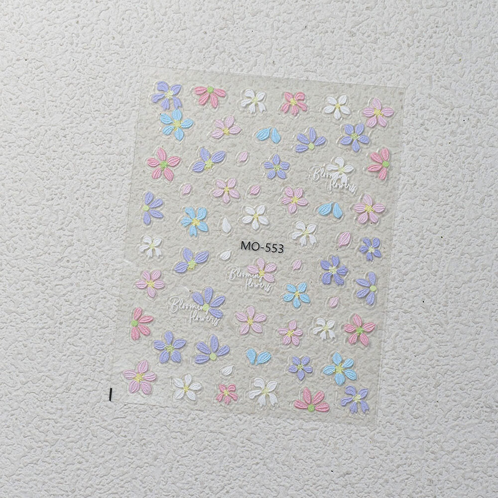 Assorted cute flower stickers in pink, yellow, purple and white arranged on sheet