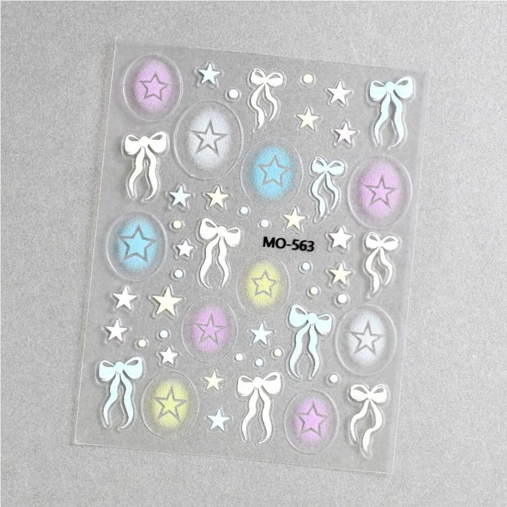 Sheet of decorative stickers with stars and bows on a gray background