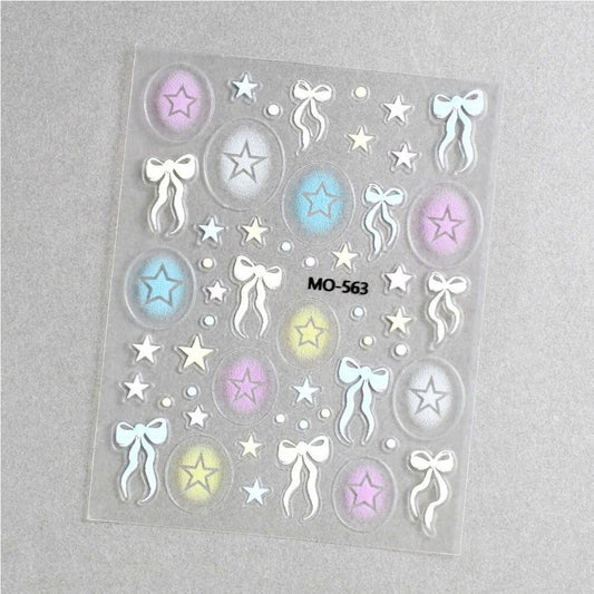 Sheet of decorative stickers with stars and bows on a gray background