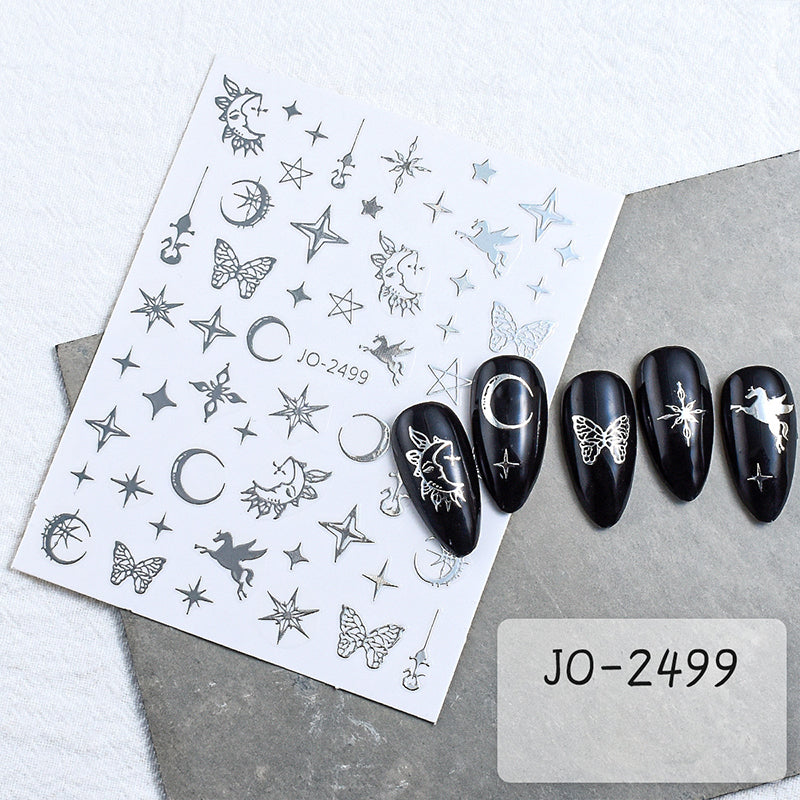 Close-up of silver butterfly sticker with detailed bohemian wing pattern