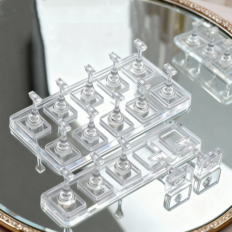 Acrylic nail display stand holding cat eye gel nails—non-magnetic fingers preserve magnetic stripe patterns.