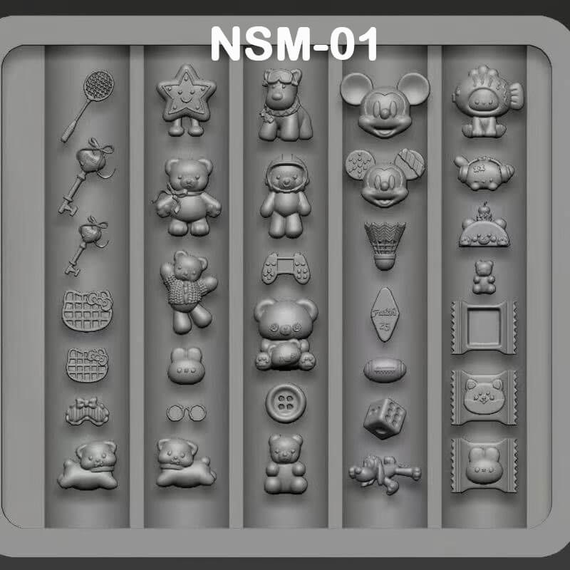 Mold with various shaped cavities including teddy bears, stars, and other objects on a gray background.