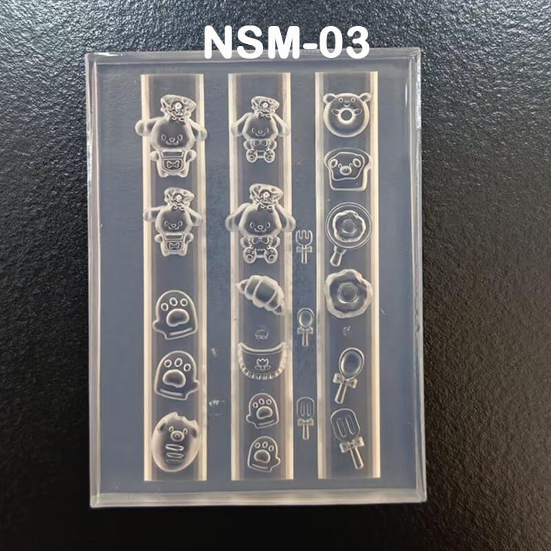 Clear silicone mold with teddy bear and paw print designs on a black background