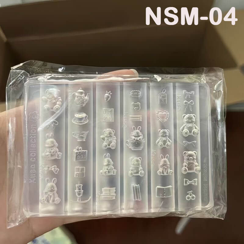 Kawaii kitchen-themed mold with bear faces, bunny silhouettes, cups, spoons, and treat shapes