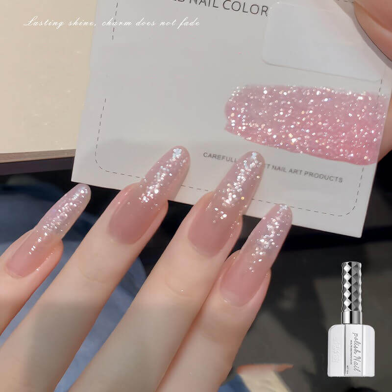 Fine sparkle nail art gel creating delicate shimmer effect like fresh snow catching light-pink