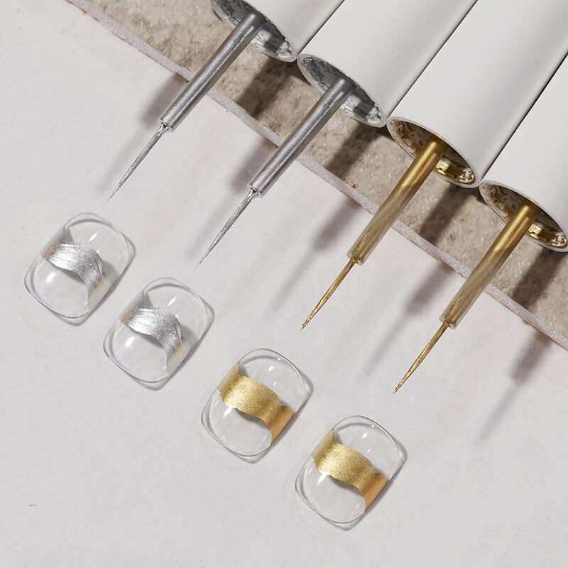 Close-up of syringes with gold and silver liquid on a light gray background