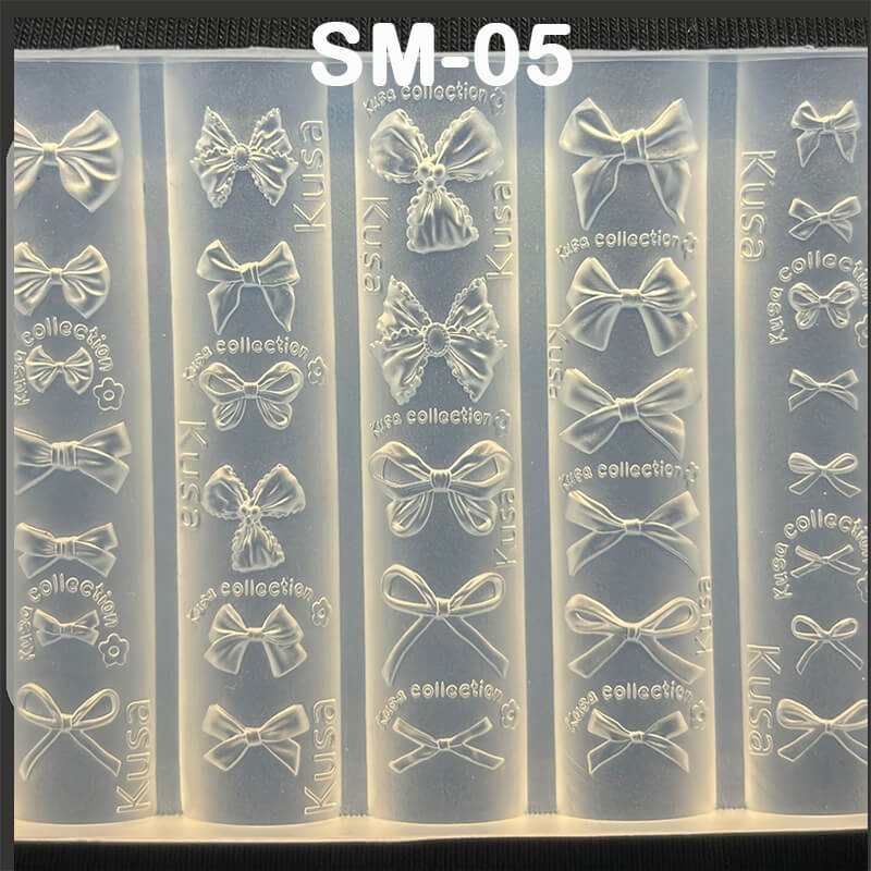 Assorted bow styles in mold—butterfly bows, ribbon bows, tied knots, and bowtie shapes