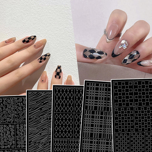 A set of nail art stickers with various geometric patterns, including zebra stripes, applied on fingernails. The stickers are black and white in color.