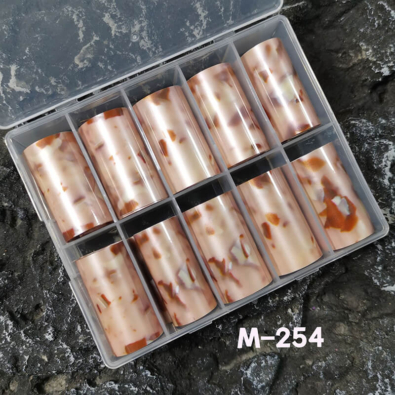 Set of cylindrical items in a clear plastic case on a dark textured surface