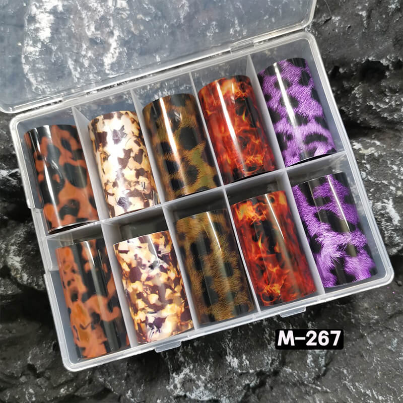 Tortoiseshell amber marble flame nail foil sheet showing warm brown and gold swirling patterns.