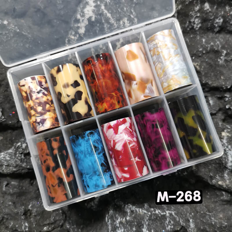 Blue flame amber marble flame nail foil sheet showing warm brown and gold swirling patterns.