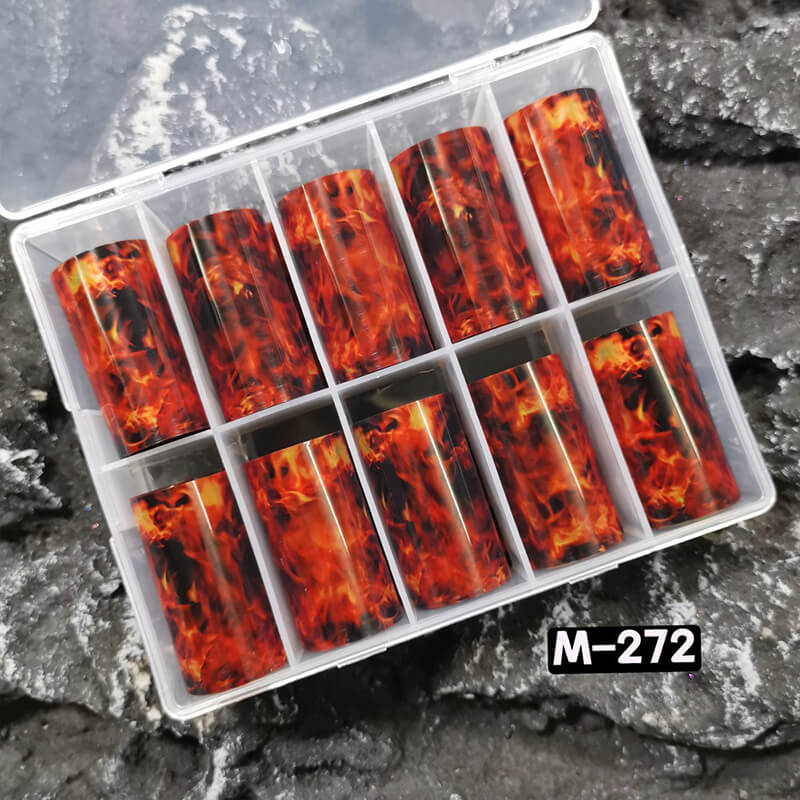 red flame nail foil sheet showing warm brown and gold swirling patterns.