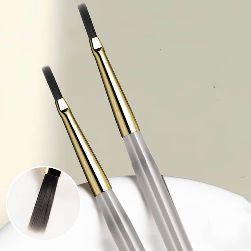 Close-up of ultra-fine liner brush tip showing precision point for detailed line work