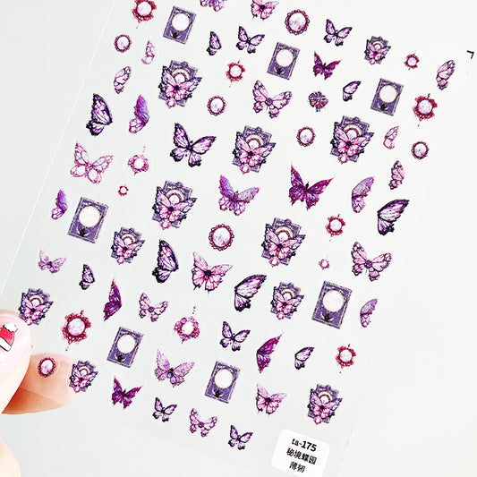 A sheet of nail art stickers with various butterfly designs in pink, purple, and white colors.