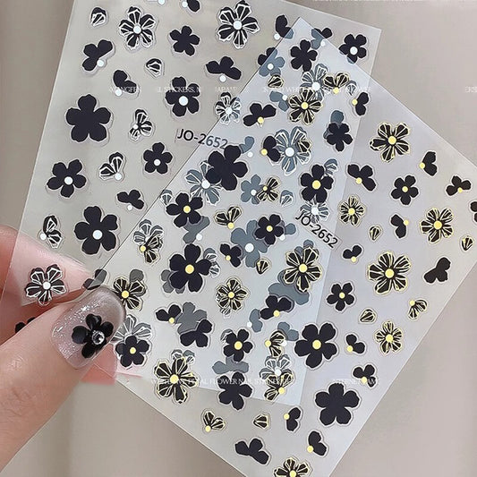 Camellia nail art stickers sheet with delicate pink and white flower designs in assorted sizes