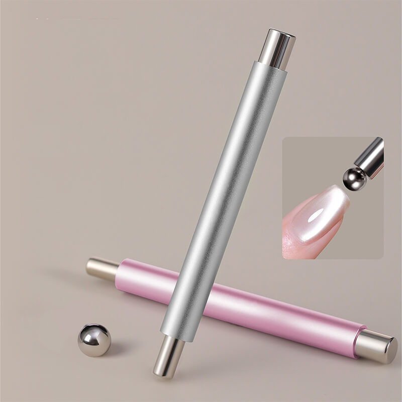 Silver and pink nail magnet with a close-up of a pink nail tip on a beige background