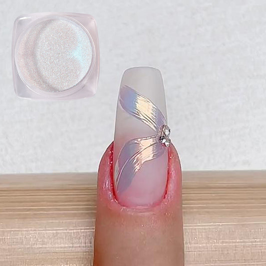 A photo showing a fingernail painted with chrome nail powder in an iridescent metallic mirror effect, alongside a close-up of the powder container.