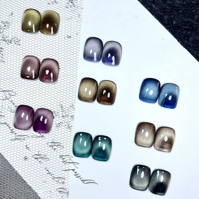 Set of gradient nail art designs on a textured surface