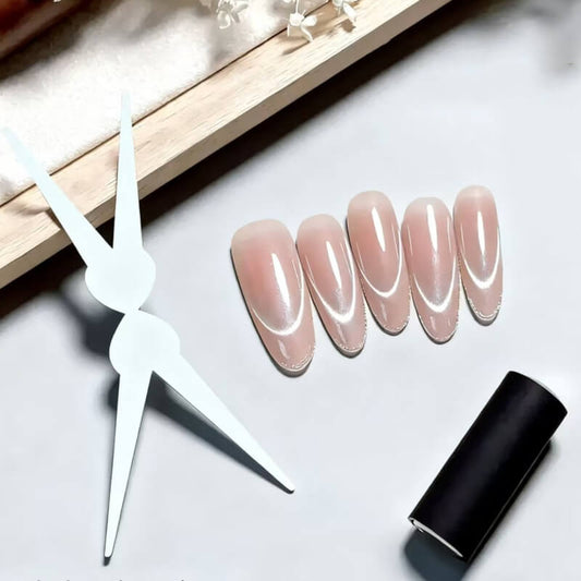 Double-ended French nail magnet tool showing cat eye magnet on one end and iron strip helper on the other.