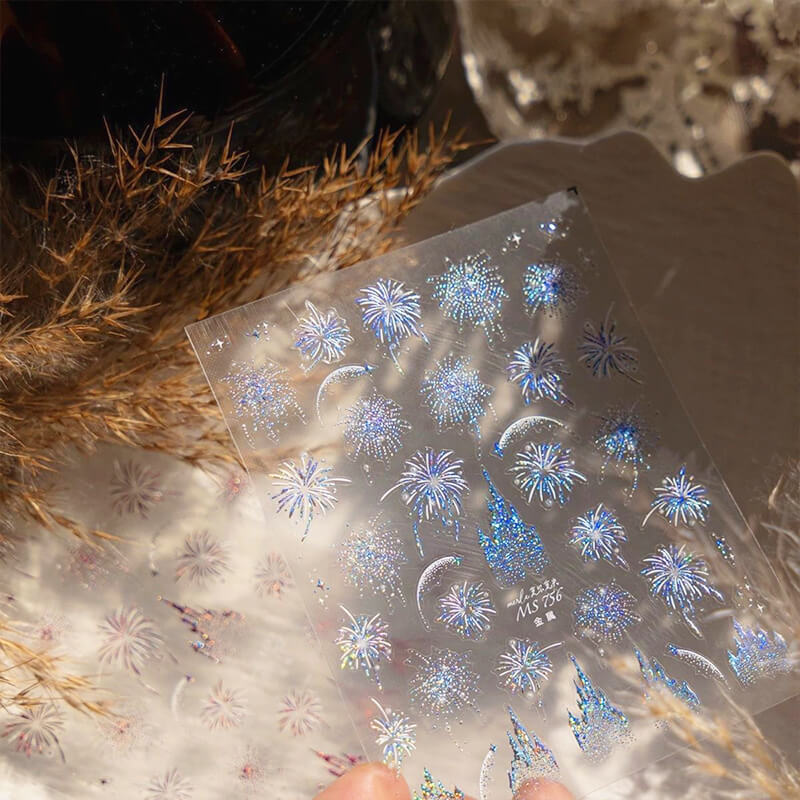 Castle and fireworks stickers arranged together creating fairy tale scene on nails