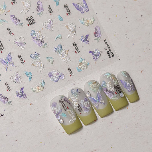 Close-up of embroidered butterfly wing showing detailed raised thread patterns