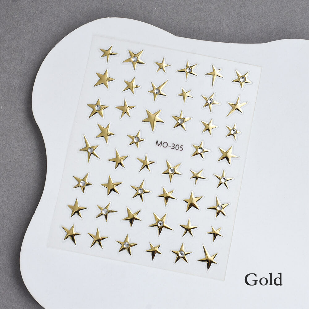 Hand model wearing rhinestone star stickers on dark base for celestial look
