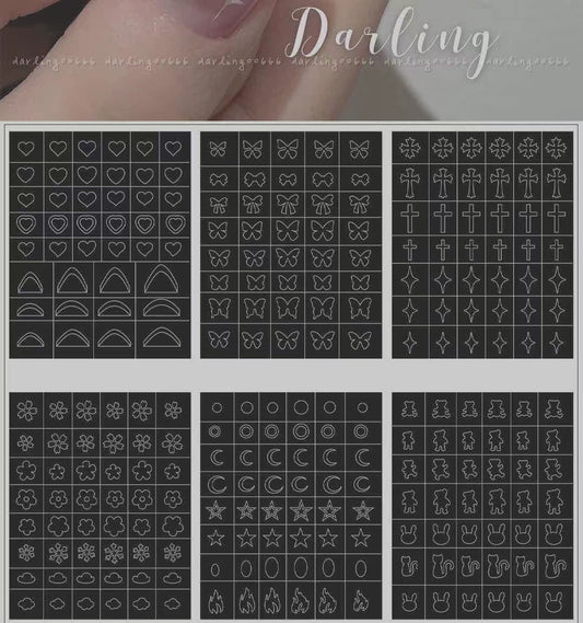 A set of nail stickers with various designs including flowers, hearts, stars, and butterflies, displayed against a transparent background.