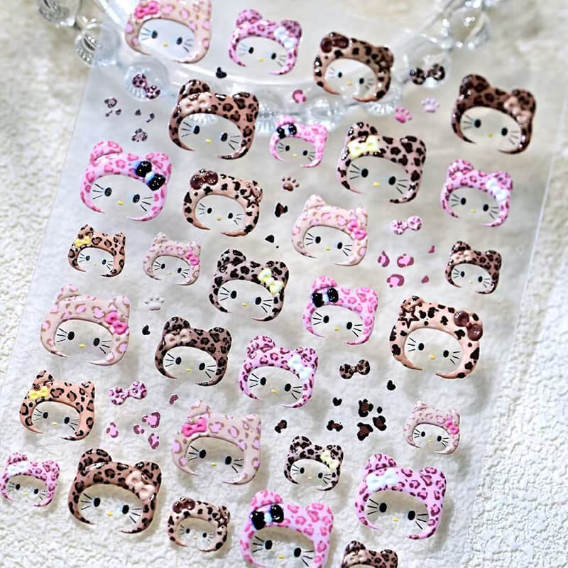 Sheet of decorative stickers with cat-themed designs on a textured surface