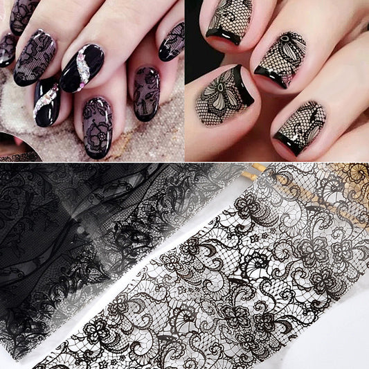 A set of nail art foil transfer stickers with floral patterns, displayed on fingernails and a swatch of lace fabric.