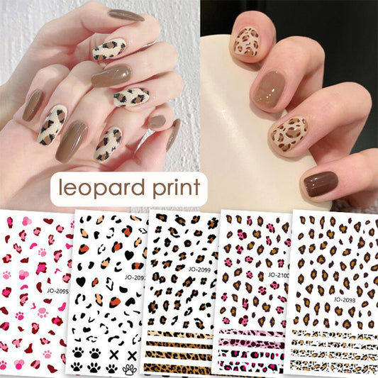 A collection of nail art stickers with leopard print designs in various colors applied on artificial nails, along with several color options shown below.