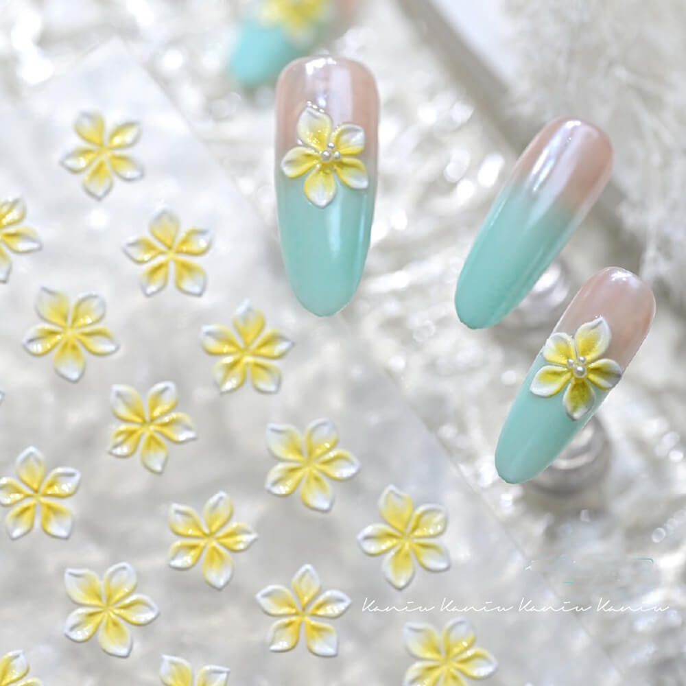 Close-up of embossed lily sticker showing dimensional petals and delicate texture